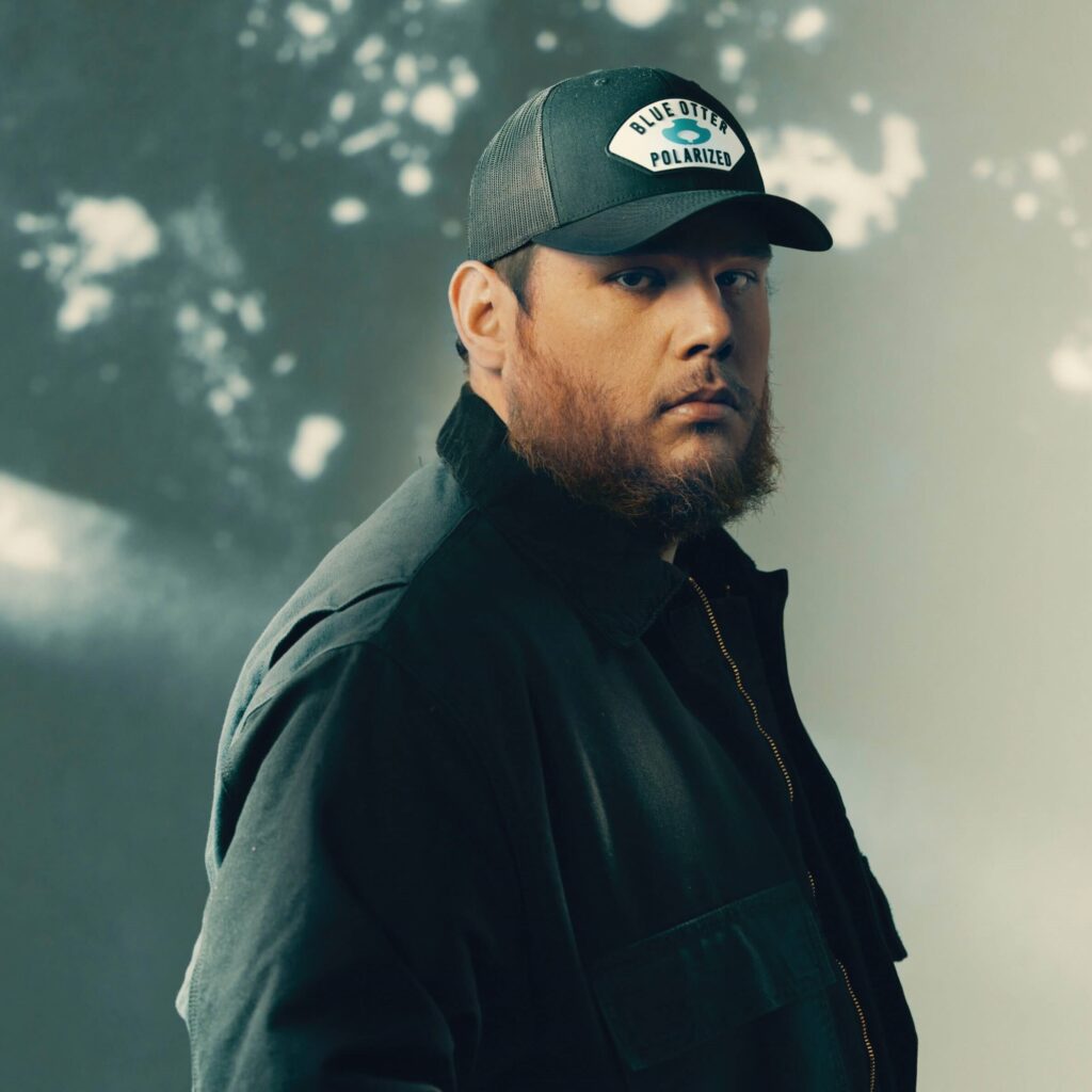 Luke Combs looking at the camera with a serious expression 